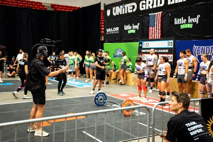 Brody Hodges filming athletes from the competition floor