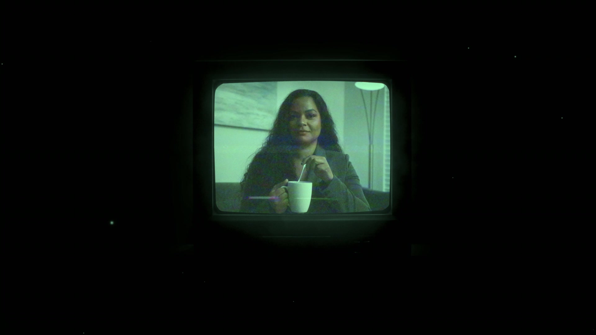 The green-tinted screen connects this environment back to the room. Its color and brightness provide a reference when judging the surrounding composite.